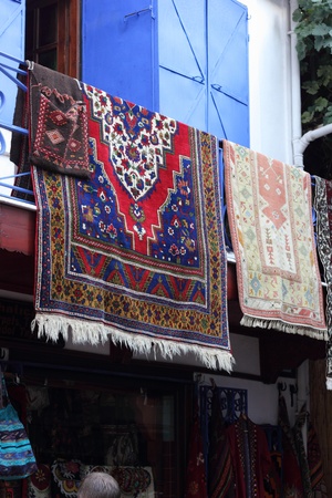 Fabrics, textiles and turkish rugs for sale at the local bazaar in Fethiye, Turkey ,July ,2013のeditorial素材
