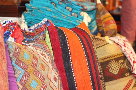 Fabrics, textiles and turkish rugs for sale at the local bazaar in Fethiye, Turkey ,July ,2013のeditorial素材