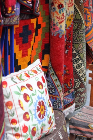 Fabrics, textiles and turkish rugs for sale at the local bazaar in Fethiye, Turkey ,July ,2013のeditorial素材