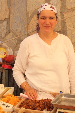 CALIS, TURKEY - 20TH JULY, 2014 A turkish lady selling her fresh spices and nuts at a local produce market in Calis, Turkey 20th july 2014のeditorial素材