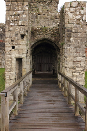 The ruins and entrance of an old medieval castle in portchester , portsmouth, Englandの写真素材