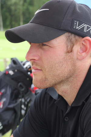25TH JUNE 2016, BLACKNEST, ENGLAND: A portrait of a golfer on a golf course at blacknest in england, 25th june 2016のeditorial素材