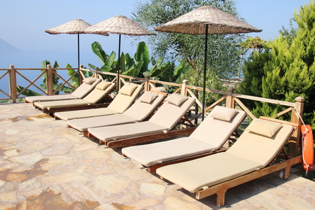 A relaxing area with sunbeds and umbrellas at Kabak in Turkey, 2016のeditorial素材