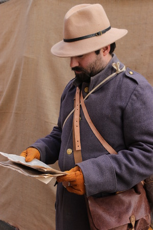 26TH NOVEMBER 2016, PORTSMOUTH DOCKYARD, ENGLAND:An unknown actor playing the part of a victorian explorer at the yearly Christmas victorian festival in portsmouth dockyard,england,26th november 2016のeditorial素材