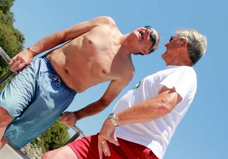 1ST JUNE 2017,TURKEY: Two unknown englishmen against a blue sky background while on vacation, 2017のeditorial素材