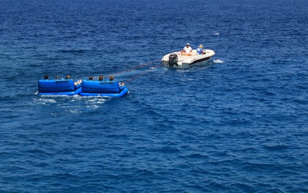 FETHIYE, TURKEY 1ST JUNE 2017: Tourists having fun riding in inflatables being pulled by a speedboat in a bay at Fethiye ,Turkey, 1st june  2017のeditorial素材