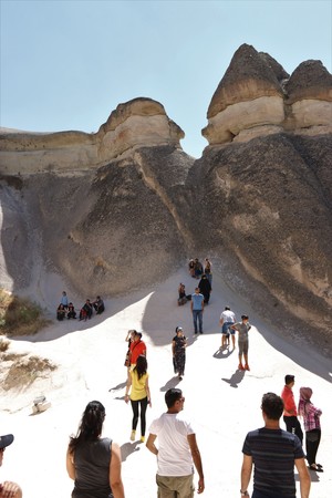 21ST JULY 2017, CAPPADOCIA,TURKEY:  Tourists visiting some of the famous Fairy chimneys in Cappadocia which were excavated by people to be used as houses and churches.のeditorial素材