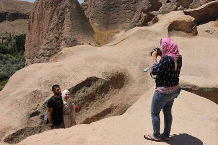 21ST JULY 2017, CAPPADOCIA, TURKEY: Tourists visiting the Selime Monastery in Cappadocia, which is one of the largest religious buildings in Cappadocia.のeditorial素材
