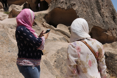 21ST JULY 2017, CAPPADOCIA, TURKEY: Tourists visiting the Selime Monastery in Cappadocia, which is one of the largest religious buildings in Cappadocia.のeditorial素材