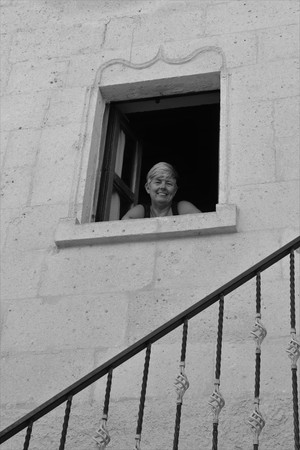 An english tourist looking out of her window from where she is staying in cappadocia in turkey,2017のeditorial素材