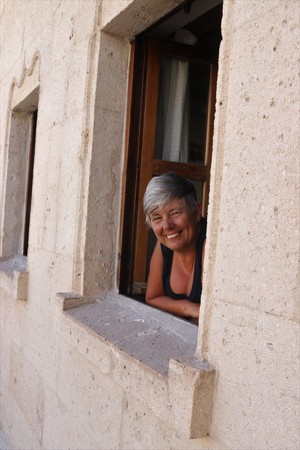 An english tourist looking out of her window from where she is staying in cappadocia in turkey,2017のeditorial素材
