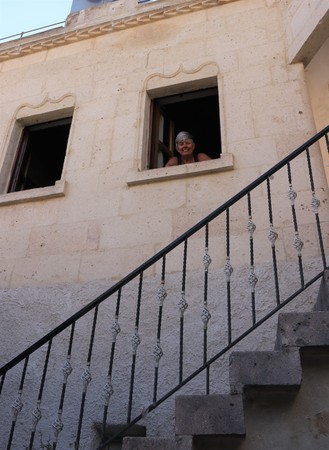 An english tourist looking out of her window from where she is staying in cappadocia in turkey,2017のeditorial素材