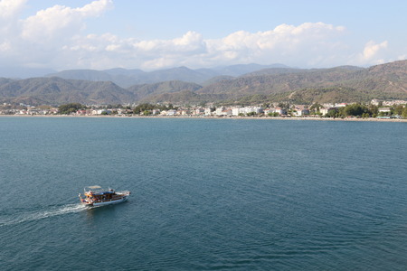 28TH JULY 2017,FETHIYE,TURKEY: A motor boat in the calm waters at calis,fethiye in turkey, 28th july 2017のeditorial素材