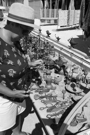 An english tourist looking at antique items for sale at Cappadocia in Turkey, 2017のeditorial素材