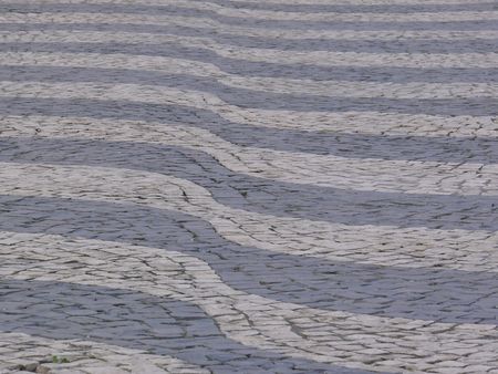 pattern of waves in Rossio in Lisbon made with little stones