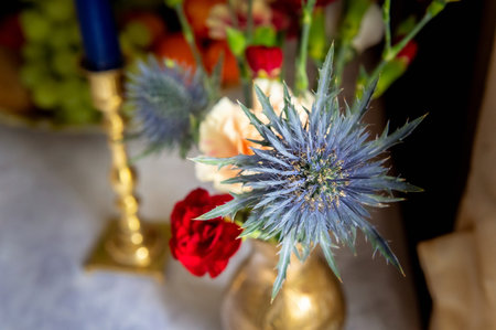 flowers bouquets bouquets and boutonnieres boutonnieres in small golden vaseの写真素材