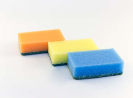Three sponges for washing dishes on white background horizontal の写真素材