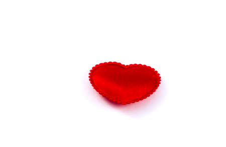 Little fabric red heart on a white backgroundの写真素材