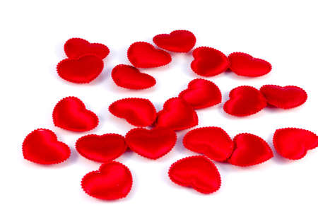 Several small red hearts tissue on a white backgroundの写真素材