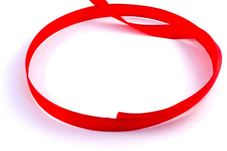 Red tape loop on a white backgroundの写真素材
