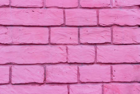 Brick wall of bricks purple streaksの写真素材