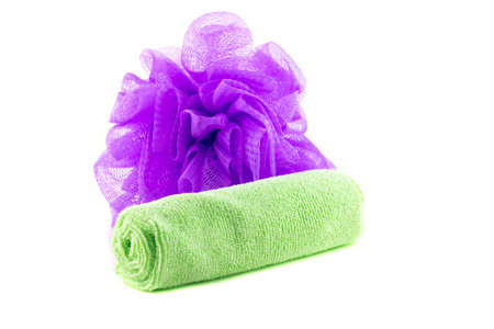 A roll of green towel with purple spongeの写真素材