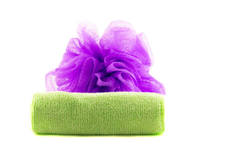 Roll of green towel with purple spongeの写真素材