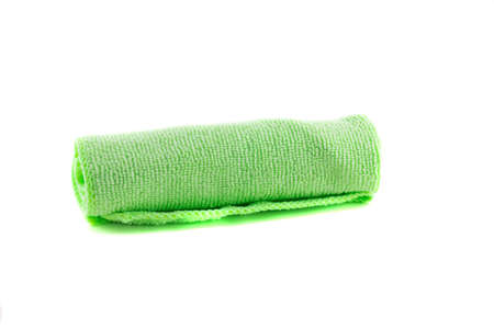 A roll of green towel on a white backgroundの写真素材