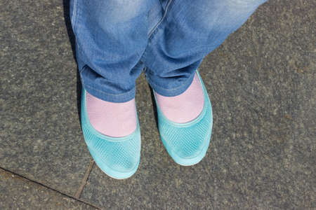 Feet and blue shoes with jeans. Selfie imageの写真素材
