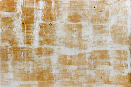 Old rusty metal wall white yellow textureの写真素材