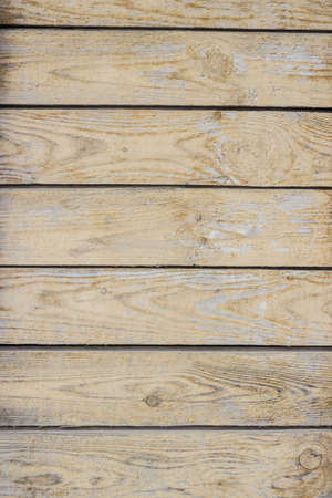 Old dilapidated wooden board with horizontal lines orange, backgroundの写真素材