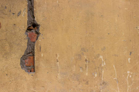 Cement on the wall with yellow stainsの写真素材