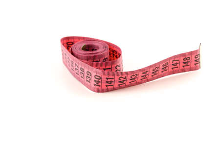 Red tape rolled into a ball on a white backgroundの写真素材