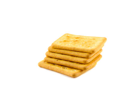 Cookies crackers stacked tower on a white backgroundの写真素材