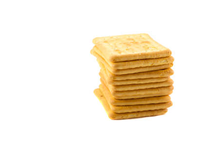 Cookies crackers stacked tower on a white backgroundの写真素材