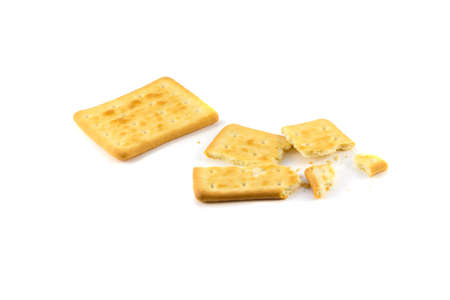 Cookies and crackers broken painted and some whole on a white backgroundの写真素材