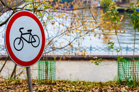 Sign of the bicycle is prohibited on the background of the fall of the waterfrontの写真素材