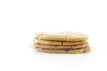 Cookies stacked in plastic pack on the white backgroundの写真素材
