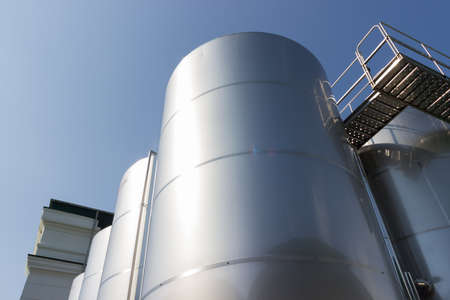 Metal technology column on the background of bright blue skyの写真素材