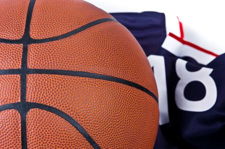 Basket ball with t-shirt on white backgroundの写真素材