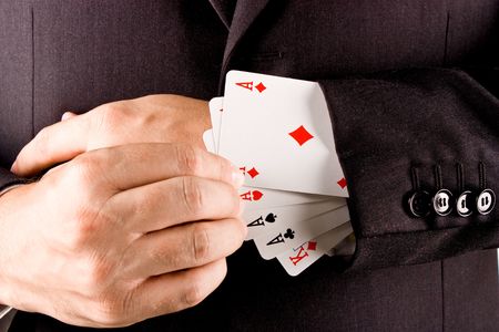 Business man with card and he has an ace up his sleeveの写真素材