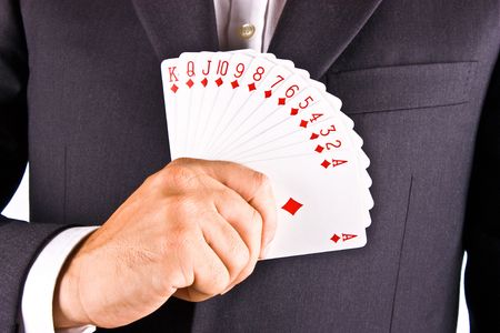 Business man with card and he has an ace up his sleeveの写真素材