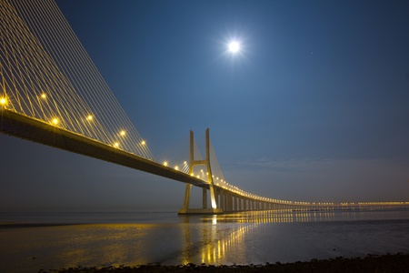 Vasco da Gama bridge under moonlightの写真素材