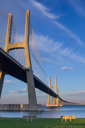 Vasco da Gama suspension Bridge, bench in frontの写真素材