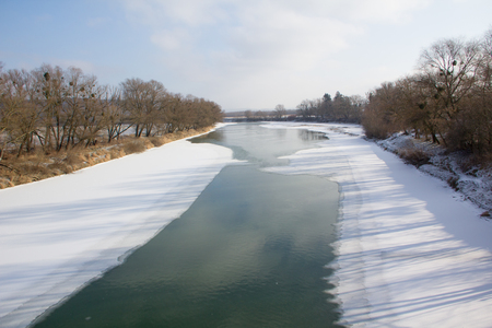 Winter river and trees landscape in Ukraineの写真素材
