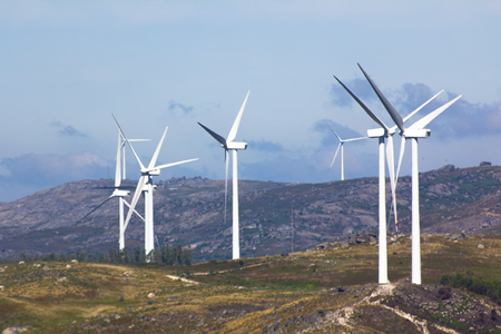 View of a wind farm with a blue sky and cloudsの写真素材