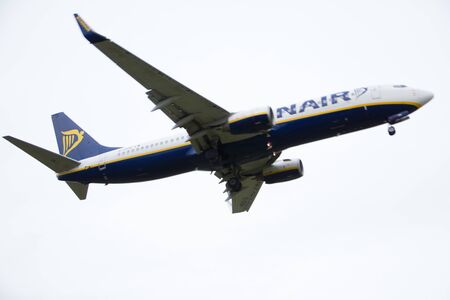 BIRMINGHAM, UK - March 02, 2019: Ryanair plane isolated on the white background in the air is landing at the International Airport in Birminghamのeditorial素材