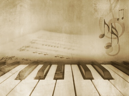 Grunge musical background - piano keys and sheet music - vintage design in sepia toneの写真素材