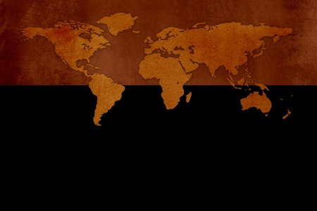 Old grunge world map against black backgroundの写真素材