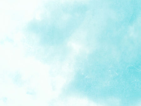 Light blue sky background in pastel watercolor style fading to whiteの写真素材